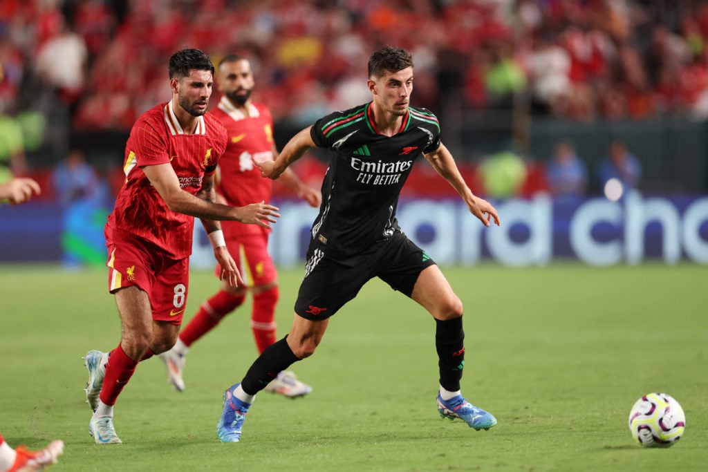 Liverpool's Hungarian midfielder #08 Dominik Szoboszlai and Arsenal's German midfielder #29 Kai Havertz vie for the ball during the pre-season club...