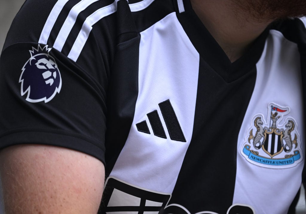 The Adidas logo is seen on the shirt of the new home kit during the Premier League match between Newcastle United FC and Southampton FC at St James...