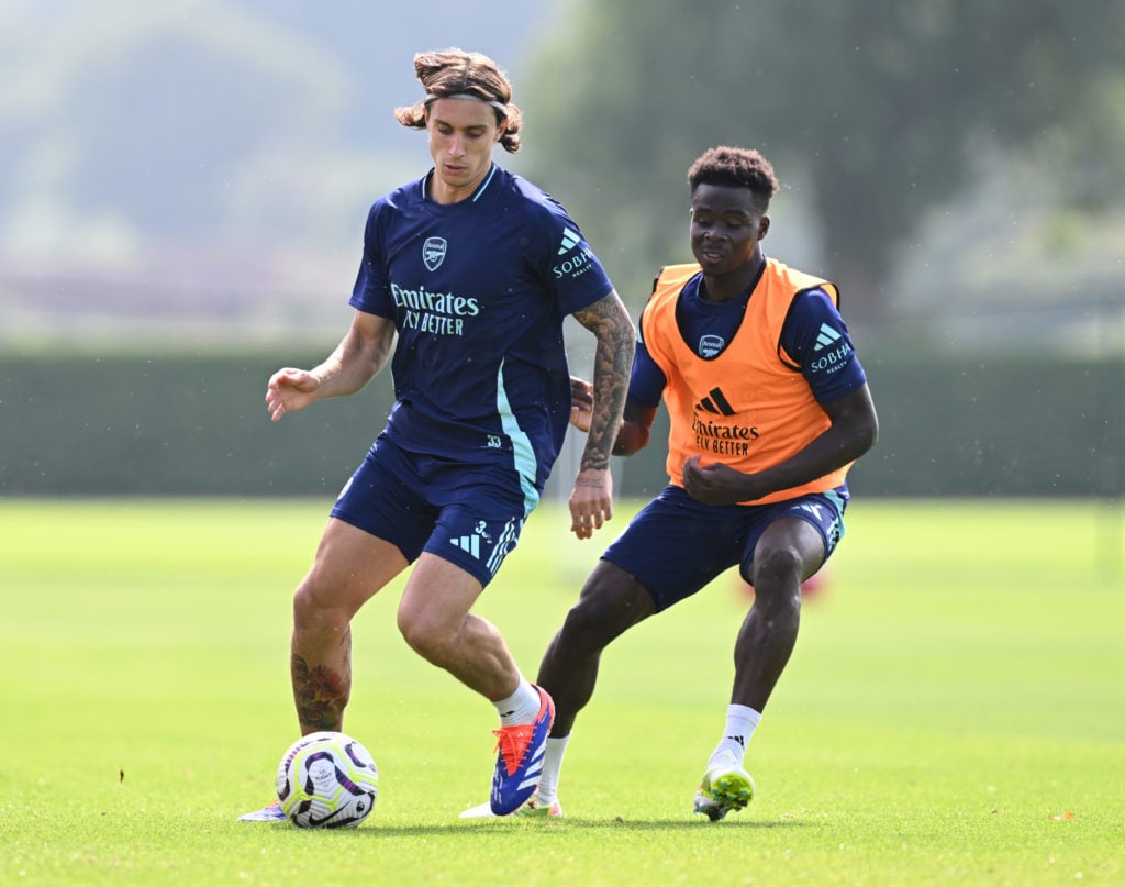 (L-R) Riccardo Calafiori and Bukayo Saka of Arsenal during a training session at Sobha Realty Training Centre on August 30, 2024 in London Colney, ...