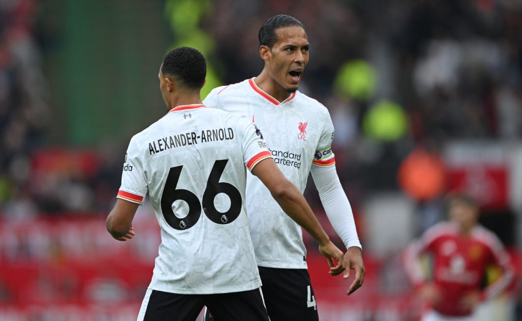 Trent Alexander-Arnold of Liverpool celebrates with teammate Virgil van Dijk, after scoring a goal, which was later ruled out for offside, followin...