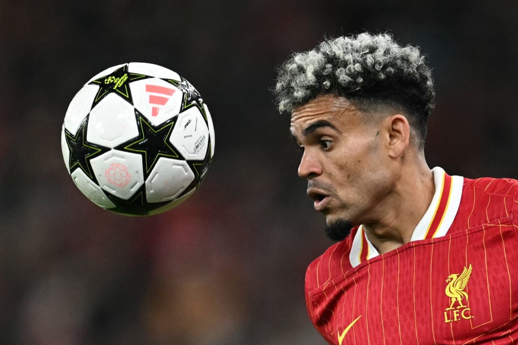 Liverpool's Colombian midfielder #07 Luis Diaz headers the ballduring the UEFA Champions League league stage football match between Liverpool and B...