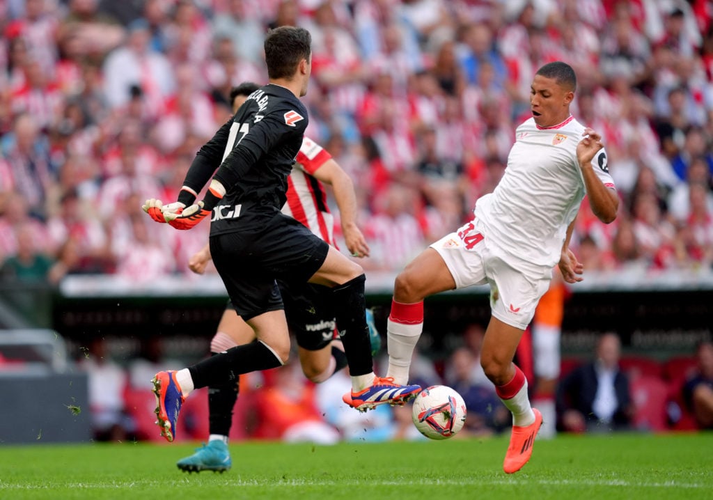 Mateo Mejia of Sevilla FC is fouled by ath13during the LaLiga match between Athletic Club and Sevilla FC  at Estadio de San Mames on September 29, ...