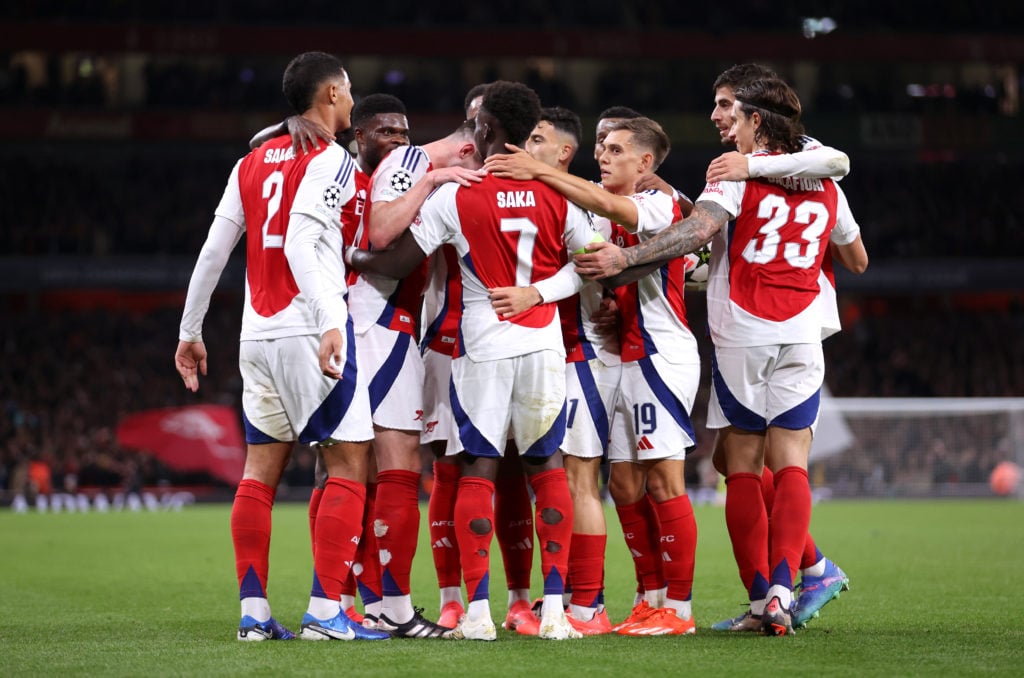 Bukayo Saka of Arsenal celebrates scoring his team's second goal with teammates during the UEFA Champions League 2024/25 League Phase MD2 match bet...