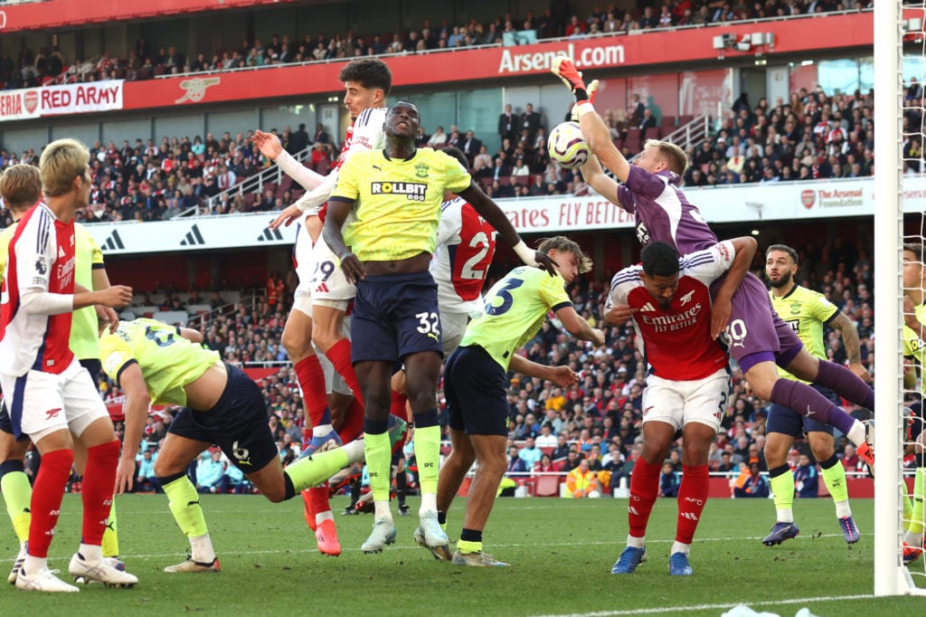 Southampton goalkeeper Aaron Ramsdale makes a save as he is challenged by William Saliba of Arsenal during the Premier League match between Arsenal...