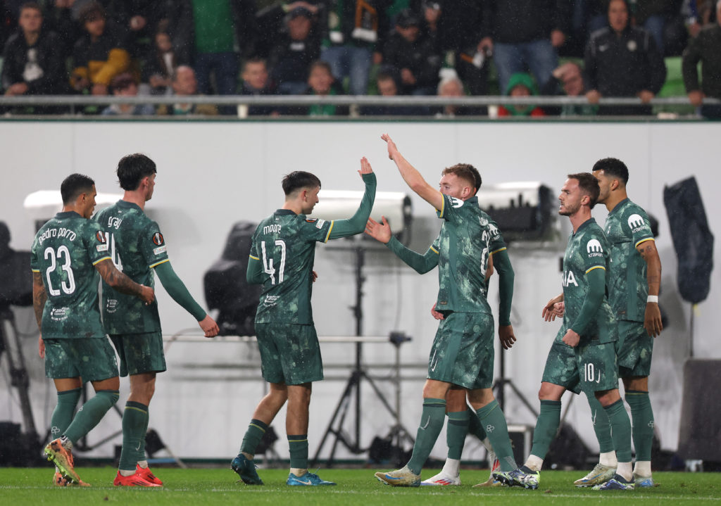 Tottenham players including Mikey Moore celebrate a goal
