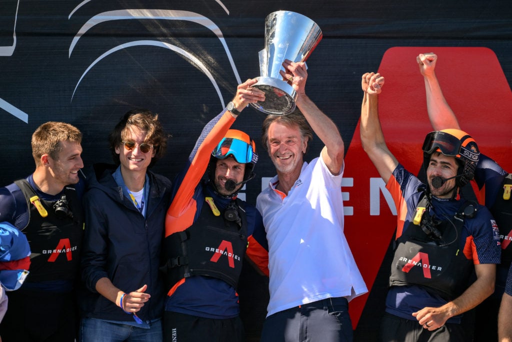 Sir Ben Ainslie skipper of the AC75 Ineos Britannia and Ineos CEO Sir Jim Ratcliffe celebrate with the Louis Vuitton Cup after defeating The AC75 L...