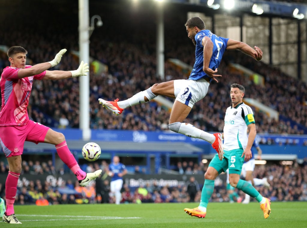 Dominic Calvert-Lewin of Everton shoots whilst under pressure from Nick Pope of Newcastle United during the Premier League match between Everton FC...