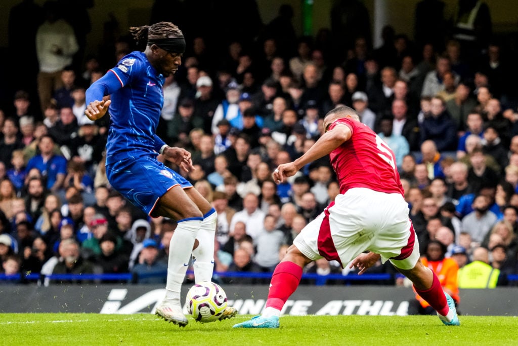 Noni Madueke of Chelsea FC and Murillo of Nottingham Forest FC battle for possession during the Premier League match between Chelsea FC and Notting...