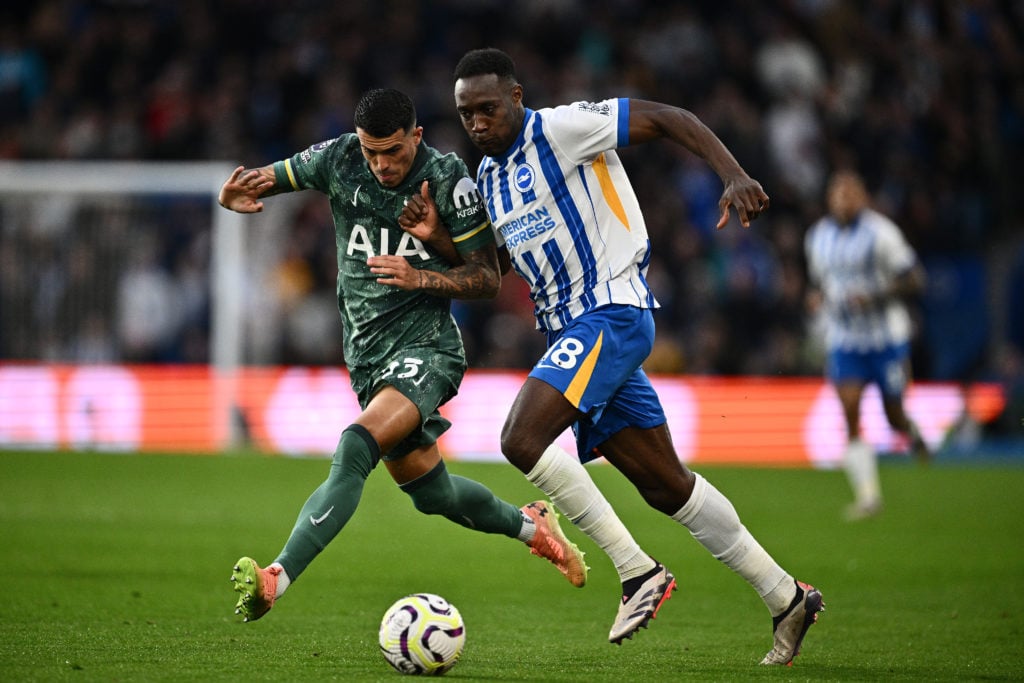 Pedro Porro of Tottenham Hotspur FC  and Danny Welbeck of Brighton & Hove Albion F.C. in action during the Premier League match between Brighto...