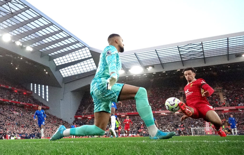 Curtis Jones scores Liverpool's second goal during the Premier League match between Liverpool FC and Chelsea FC at Anfield on October 20, 2024 in L...