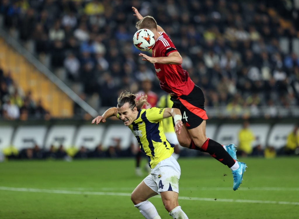 Caglar Soyuncu (4) of Fenerbahce in action against Matthijs De Ligt (R) of Manchester United during the UEFA Europa League week 3 football match be...