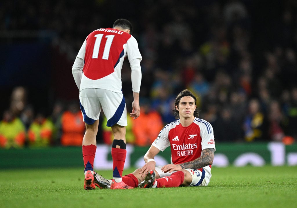 Riccardo Calafiori of Arsenal goes down with a injury as Gabriel Martinelli of Arsenal checks on him during the UEFA Champions League 2024/25 Leagu...