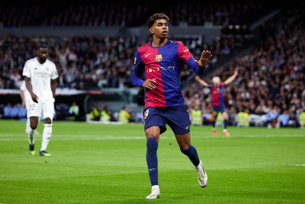 Lamine Yamal of FC Barcelona celebrates after scoring their side's third goal during the LaLiga match between Real Madrid CF and FC Barcelona at Es...