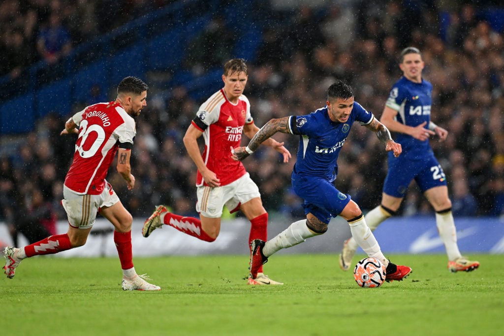 Enzo Fernandez of Chelsea runs with the ball whilst under pressure from Jorginho of Arsenal during the Premier League match between Chelsea FC and ...