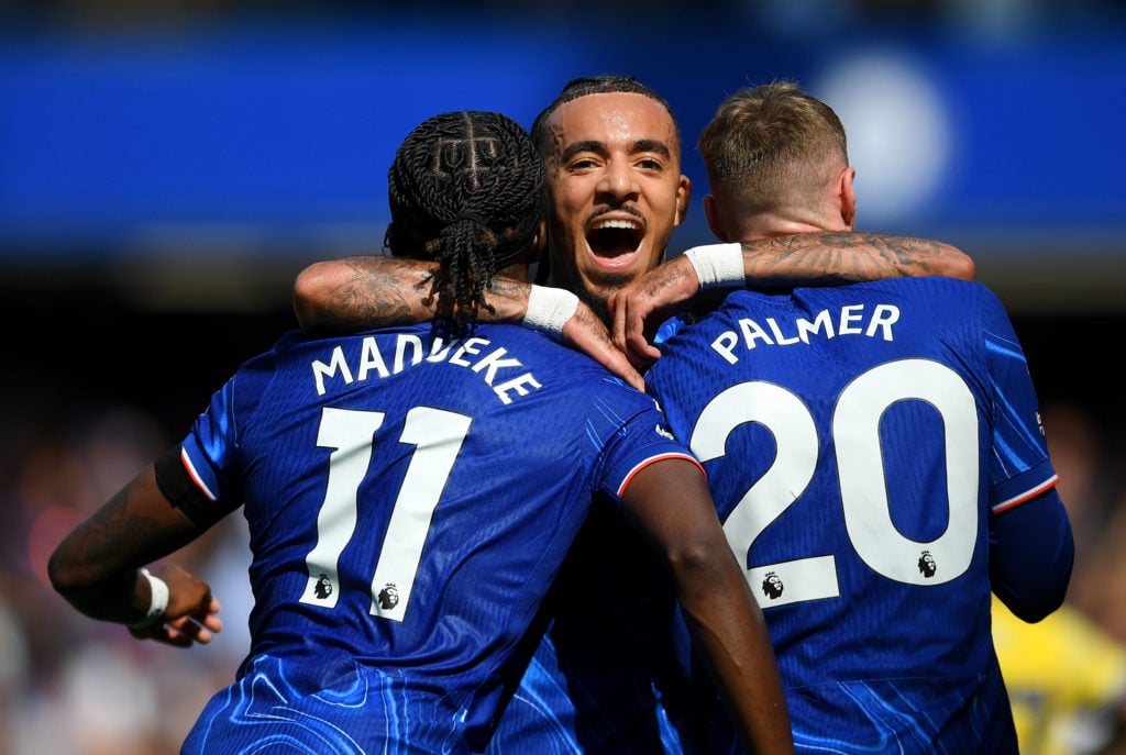 Malo Gusto (C), Noni Madueke and Cole Palmer of Chelsea celebrate after Nicolas Jackson of Chelsea (not pictured) scores his team's first goal duri...