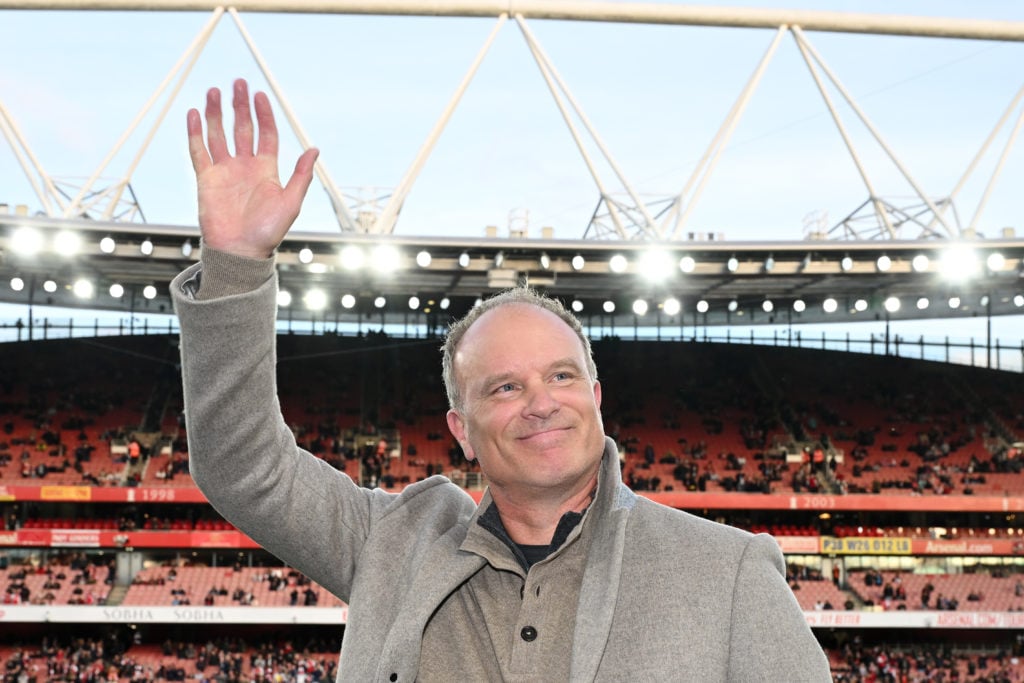 Former Arsenal player Dennis Bergkamp acknowledges the fans prior to the Premier League match between Arsenal FC and Liverpool FC at Emirates Stadi...