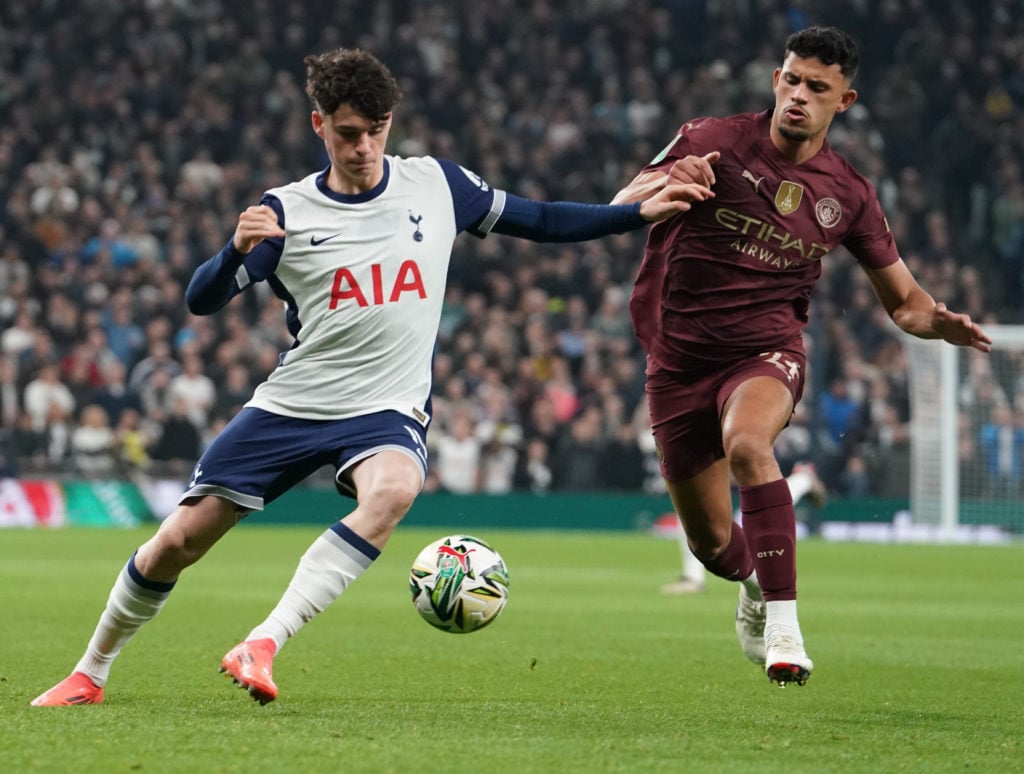 Tottenham Hotspur's Archie Gray battles with Manchester City's Matheus Nunes
 during the Carabao Cup Fourth Round match between Tottenham Hotspur a...