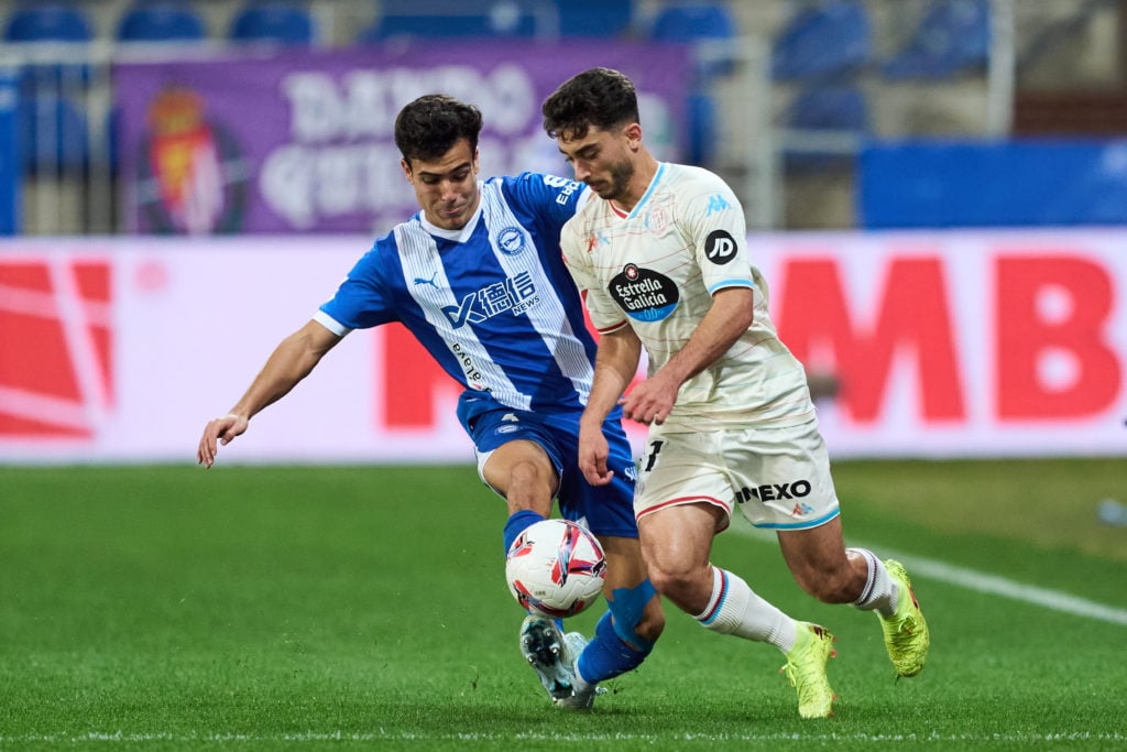 Manu Sanchez of Deportivo Alaves duels for the ball with Raul Moro of Real Valladolid Mario Martin during the LaLiga match between Deportivo Alaves...