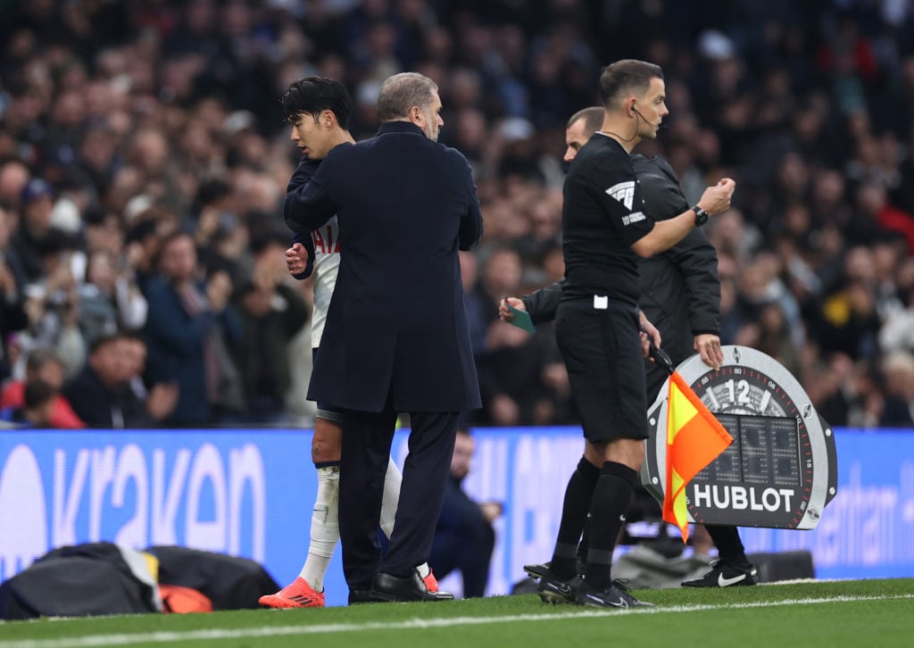 Son Heung-Min of Tottenham Hotspur is hugged by Manager Ange Postecoglou, after being substituted during the Premier League match between Tottenham...