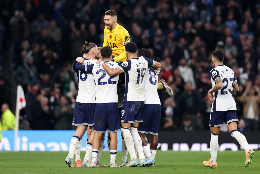 Tottenham Hotspur players celebrate after teammate James Maddison (blocked) scores their team's fourth goal from a free kick during the Premier Lea...