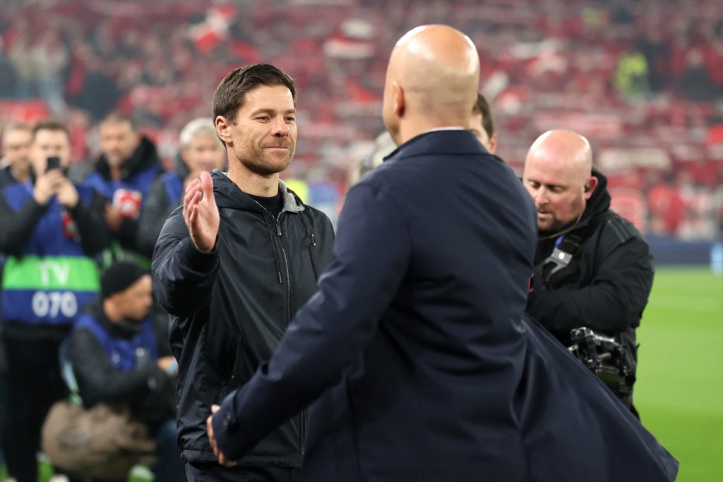 Xabi Alonso, Head Coach of Bayer 04 Leverkusen, and Arne Slot, Manager of Liverpool, interact prior to kick-off ahead of the UEFA Champions League ...