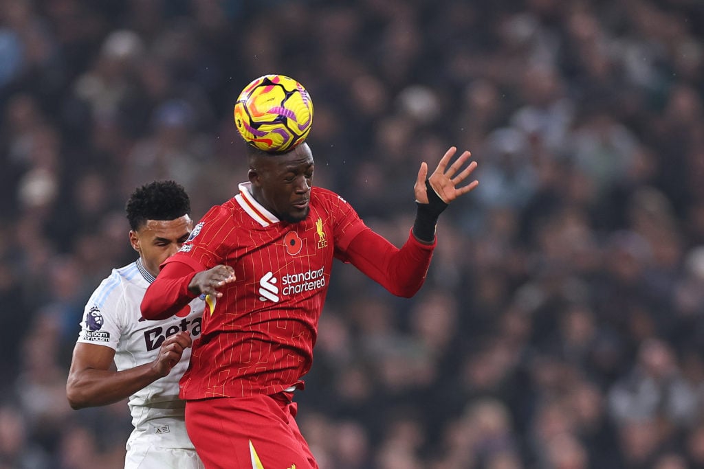 Ibrahima Konate of Liverpool wins a header against Ollie Watkins of Aston Villa during the Premier League match between Liverpool FC and Aston Vill...