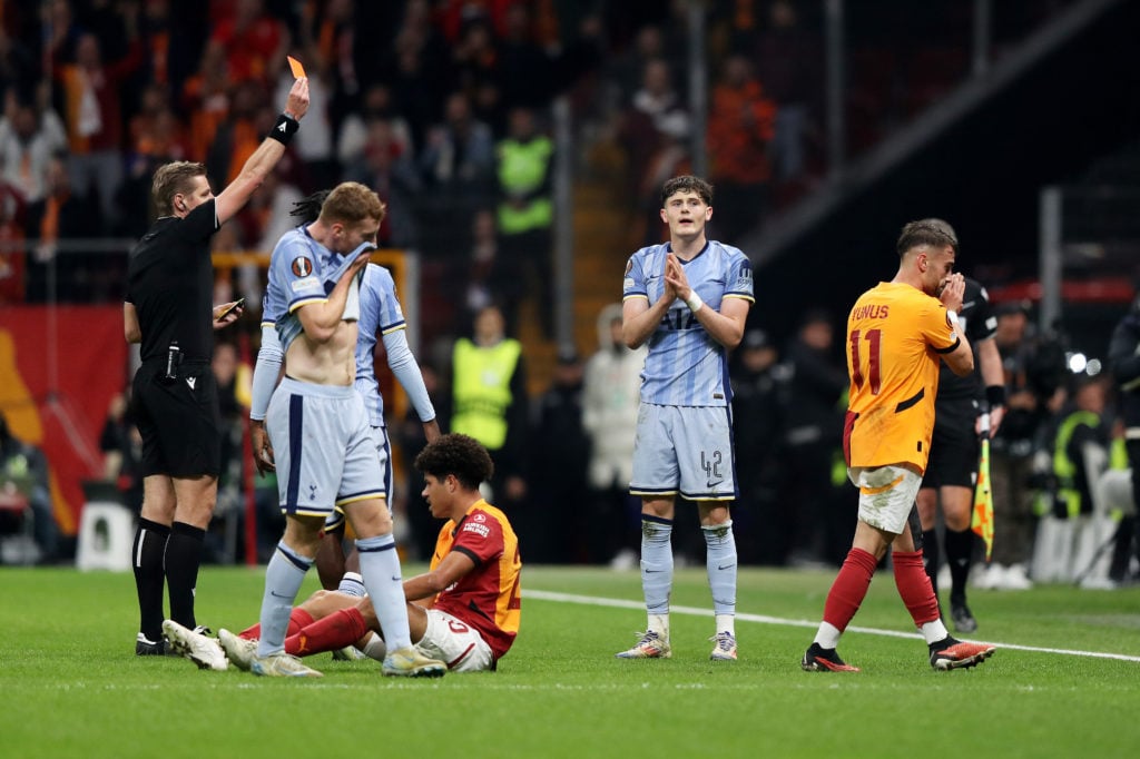 Referee Lawrence Visser shows a red card to Will Lankshear of Tottenham Hotspur following a second yellow card during the UEFA Europa League 2024/2...