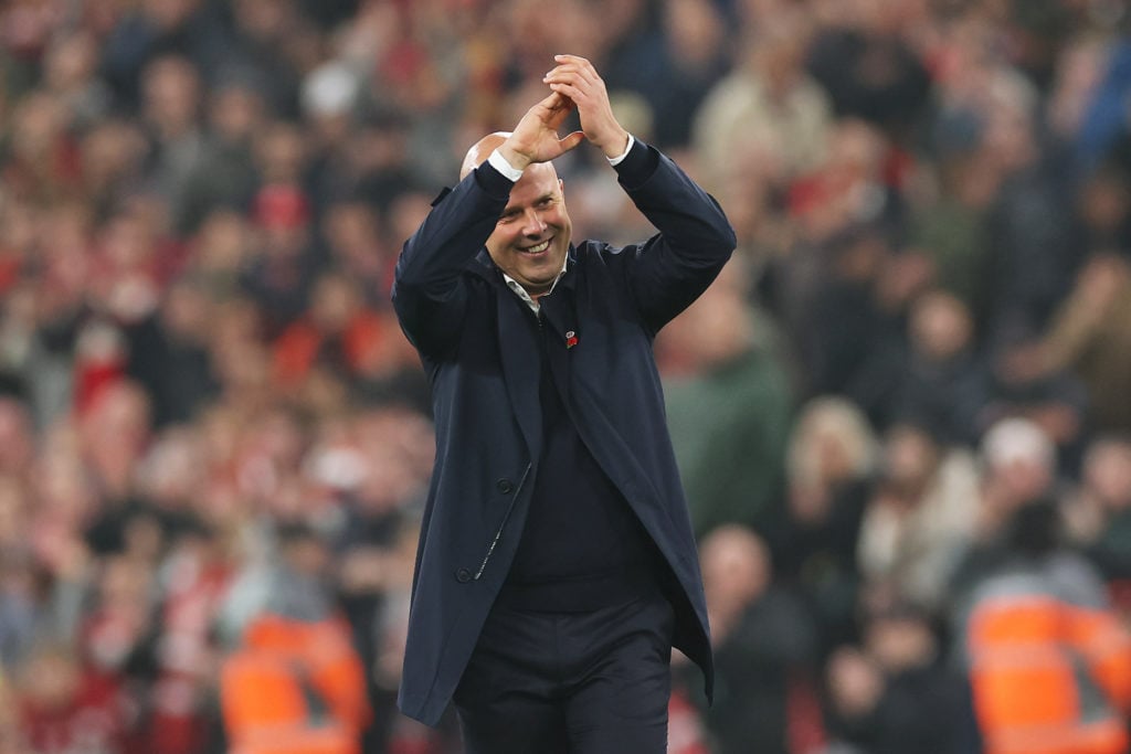 Arne Slot, Manager of Liverpool, acknowledges the fans following the team's victory during the Premier League match between Liverpool FC and Aston ...