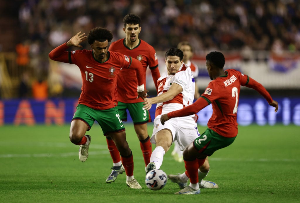 Igor Matanovic of Croatia challenges for the ball against Renato Veiga and Nelson Semedo of Portugal during the UEFA Nations League 2024/25 League ...