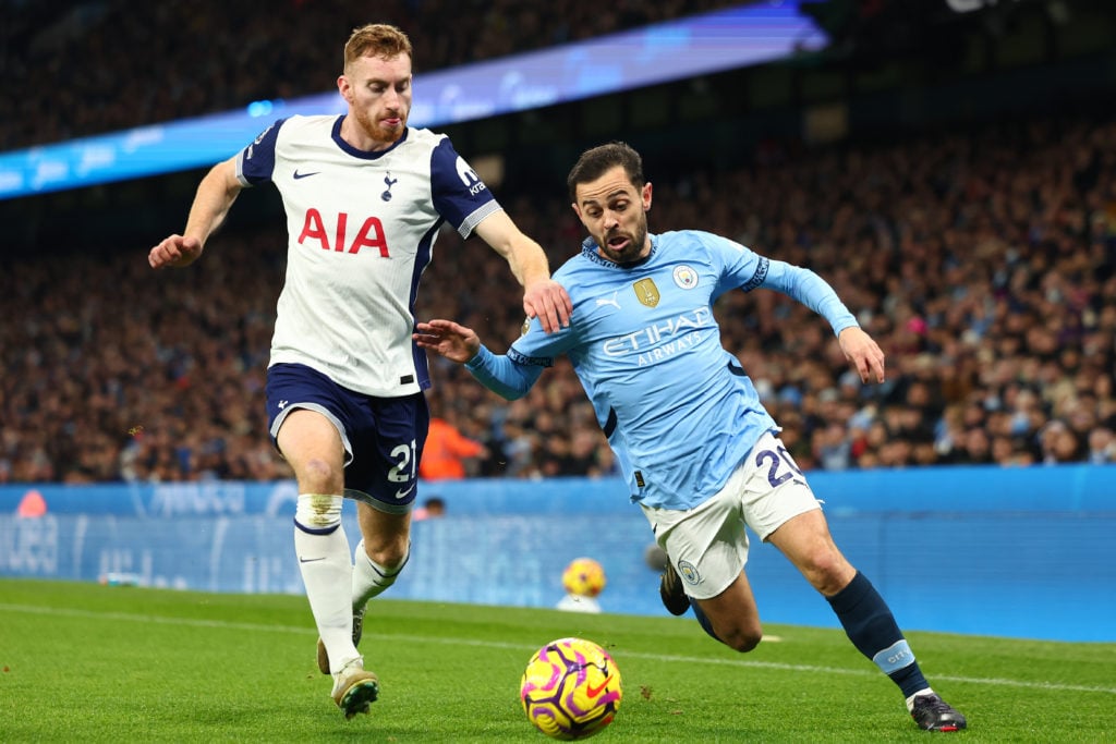 Bernardo Silva of Manchester City takes on Dejan Kulusevski of Tottenham Hotspur during the Premier League match between Manchester City FC and Tot...