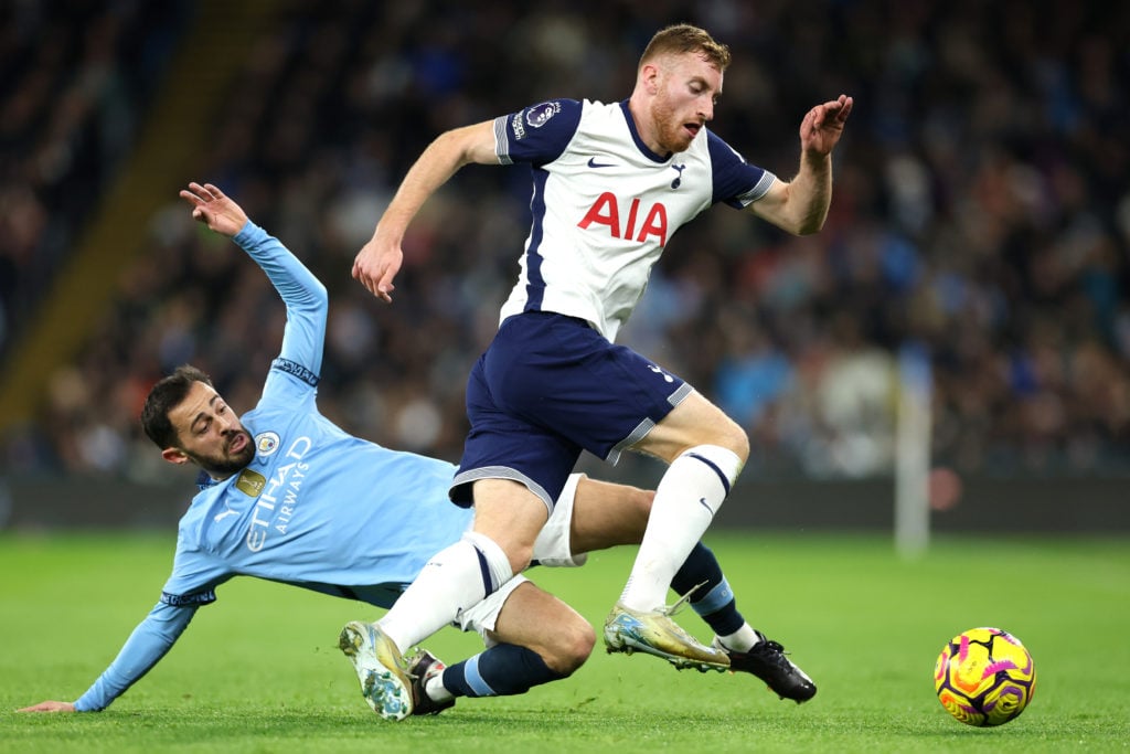 Dejan Kulusevski of Tottenham Hotspur is challenged by Bernardo Silva of Manchester City during the Premier League match between Manchester City FC...