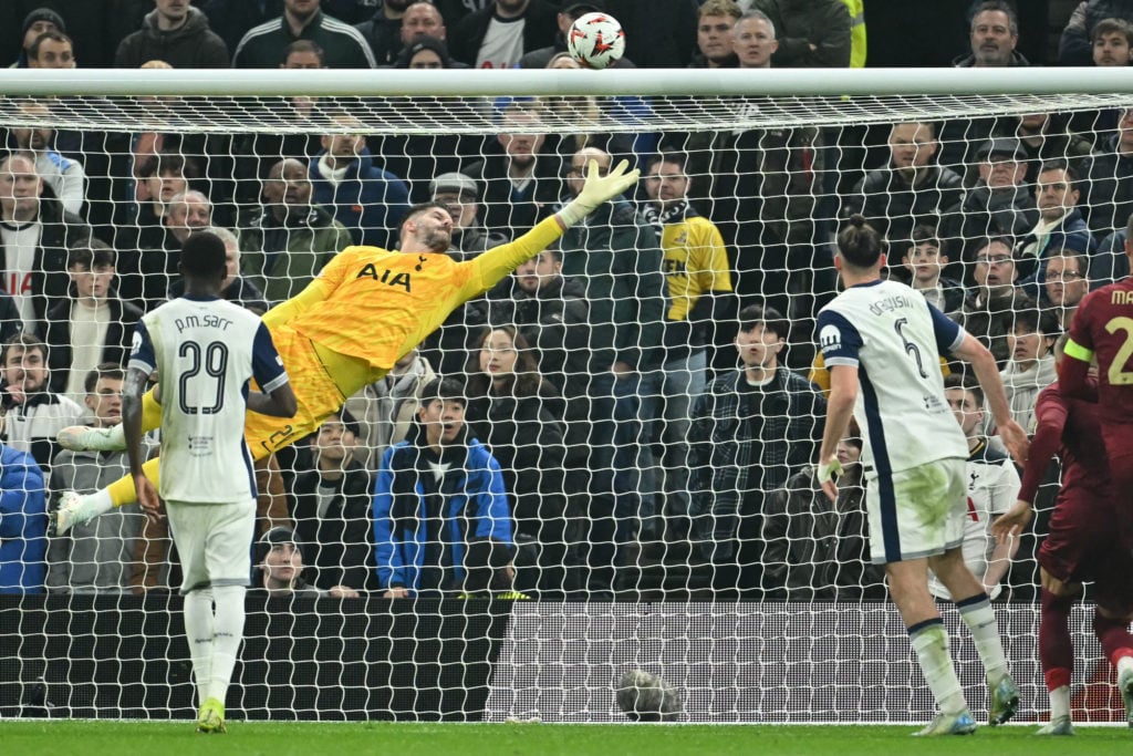 Tottenham Hotspur's English goalkeeper #20 Fraser Forster is unable to stop an attempt from Roma's French defender #05 Obite Evan Ndicka making it ...