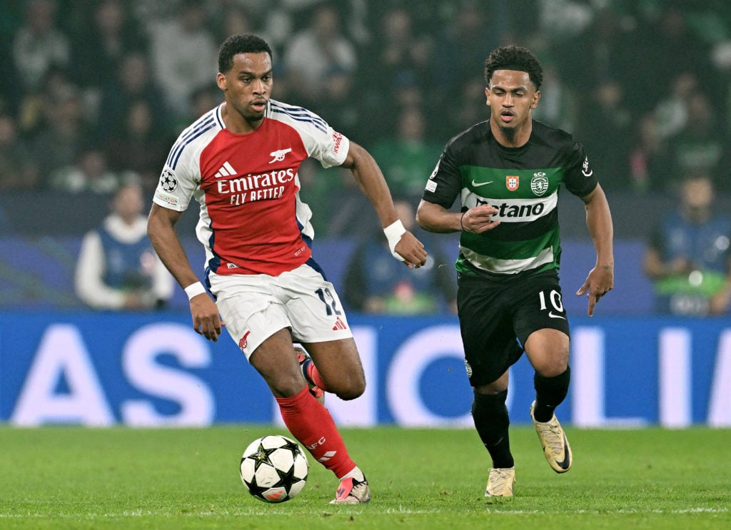 Jurrien Timber of Arsenal runs with the ball whilst under pressure from Marcus Edwards of Sporting CP during the UEFA Champions League 2024/25 Leag...