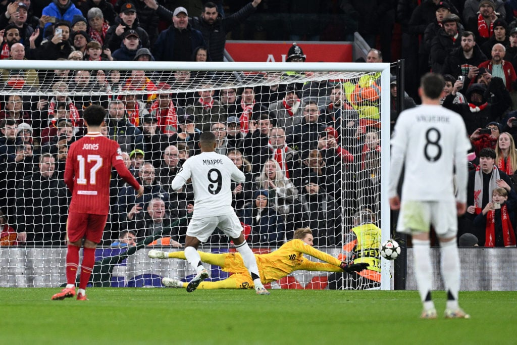 Caoimhin Kelleher of Liverpool saves a penalty from Kylian Mbappe of Real Madrid during the UEFA Champions League 2024/25 League Phase MD5 match be...