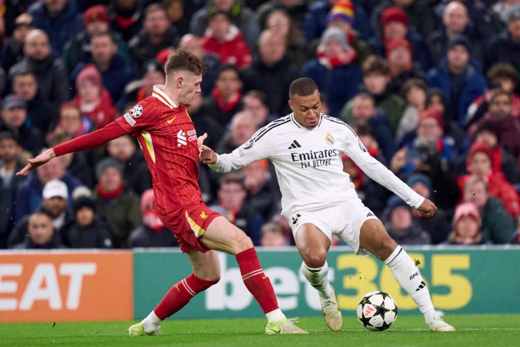 Conor Bradley of Liverpool FC compete for the ball with Kylian Mbappe of Real Madrid CF during the UEFA Champions League 2024/25 League Phase MD5 m...