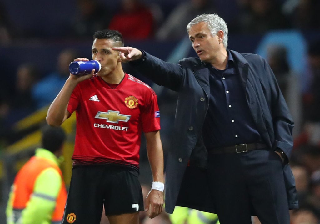 Jose Mourinho, Manager of Manchester United gives Alexis Sanchez of Manchester United instructions during the Group H match of the UEFA Champions L...