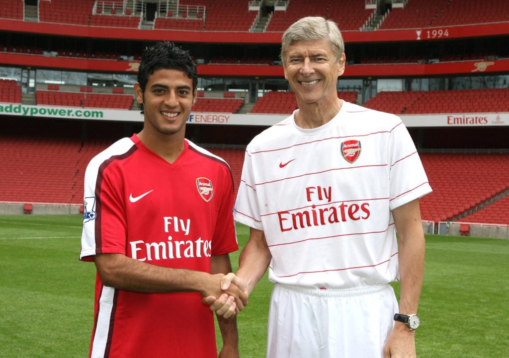 Arsene Wenger the Manager of Arsenal with Carlos Vela of Arsenal during the Arsenal 1st team photocall on August 5, 2008 in London, England.