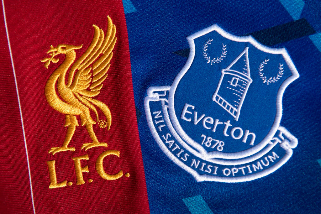 The Everton and Liverpool club crests on their first team home shirt on May 13, 2020 in Manchester, England.