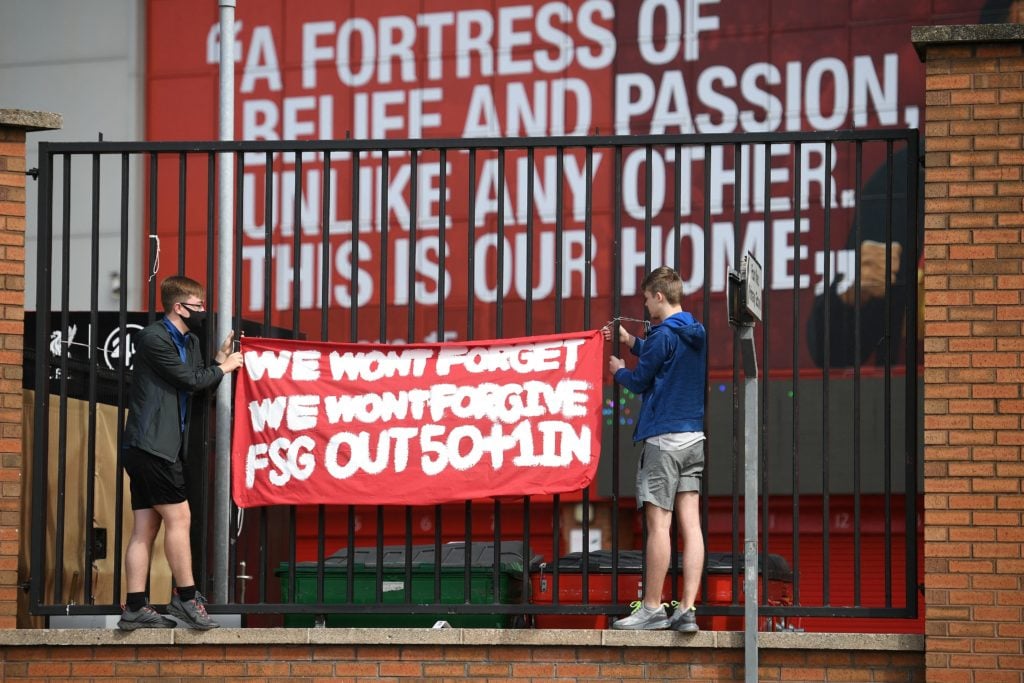 Supporters protest against Liverpool's US owner John W. Henry and the Fenway Sports Group (FSG) outside English Premier League club Liverpool's Anf...