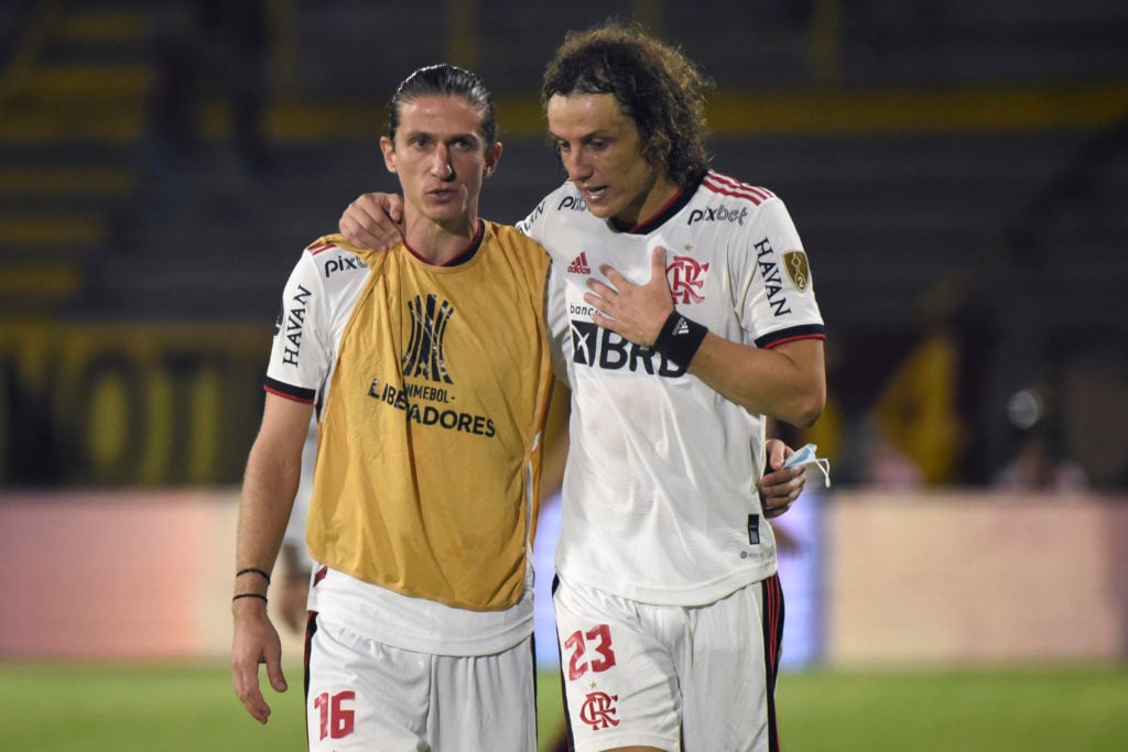 (L-R) Filipe Luís and David Luiz of Flamengo talk after winning a match between Deportes Tolima and Flamengo as part of Copa CONMEBOL Libertadores ...