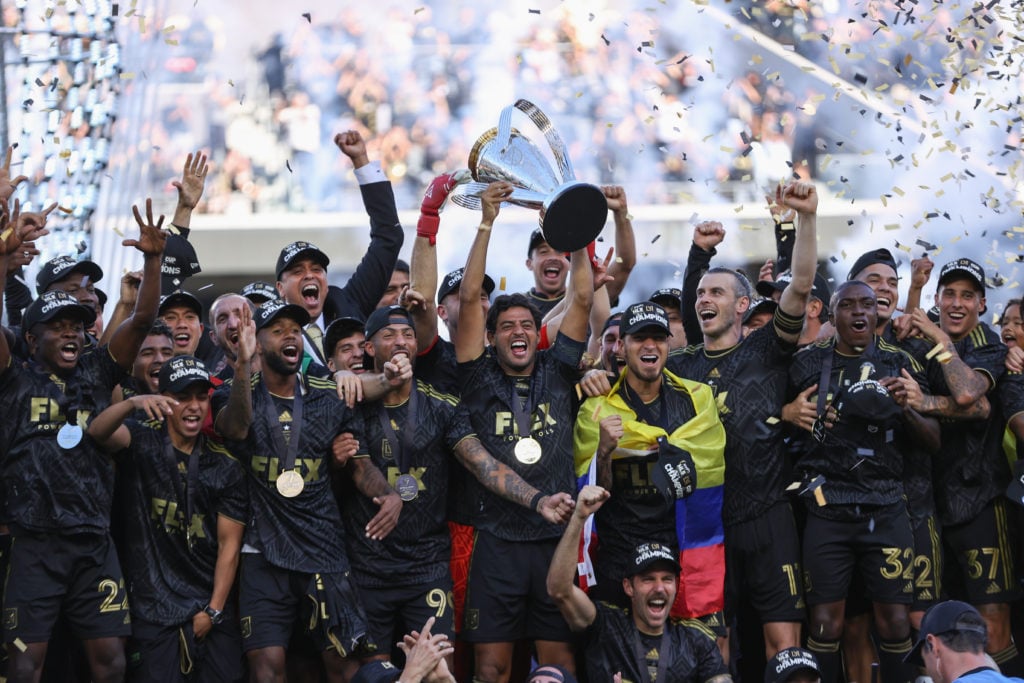 Carlos Vela #10 of LAFC lifts the trophy to celebrate with his teammates after winning the MLS Cup Final match between Philadelphia Union and LAFC ...