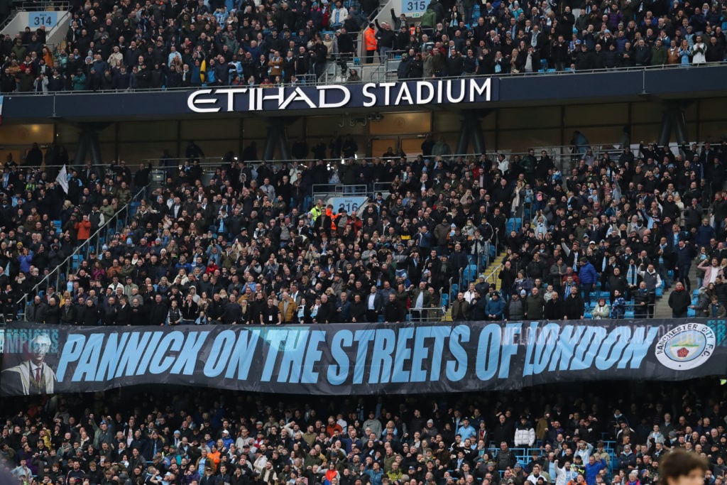 A banner depicting Manchester City solicitor Lord David Pannick KC is seen ahead of the Premier League match between Manchester City and Aston Vill...