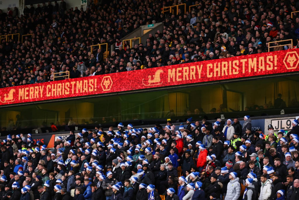 A Christmas message is displayed above the Chelsea fans during the Premier League match between Wolverhampton Wanderers and Chelsea FC at Molineux ...