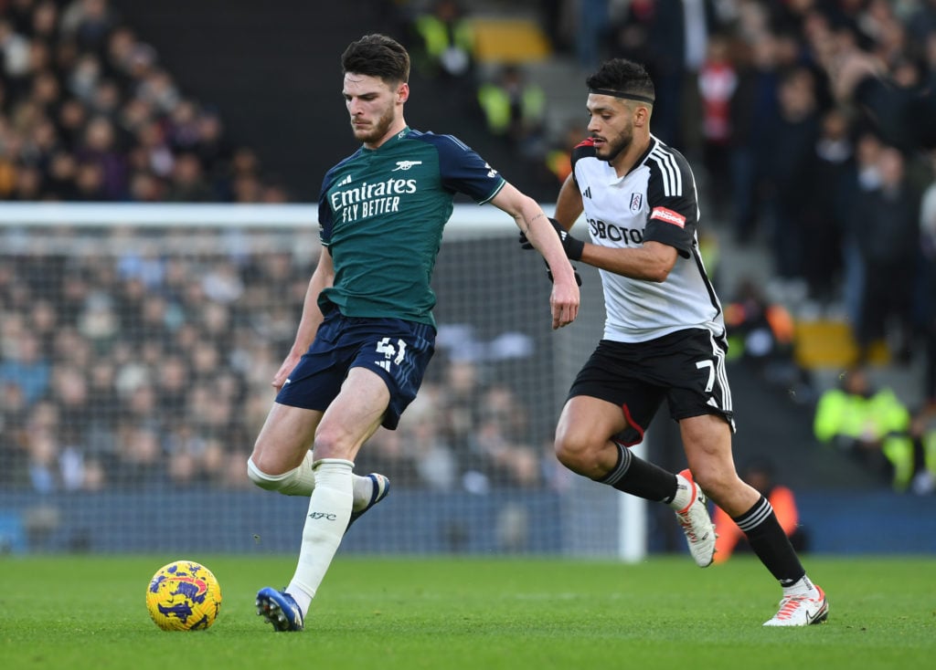 Declan Rice of Arsenal is closed down by Raul Jimenez of Fulham during the Premier League match between Fulham FC and Arsenal FC at Craven Cottage ...