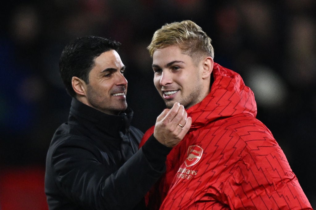 Arsenal's Spanish manager Mikel Arteta (L) speaks with Arsenal's English midfielder #10 Emile Smith Rowe at the end of the English Premier League f...