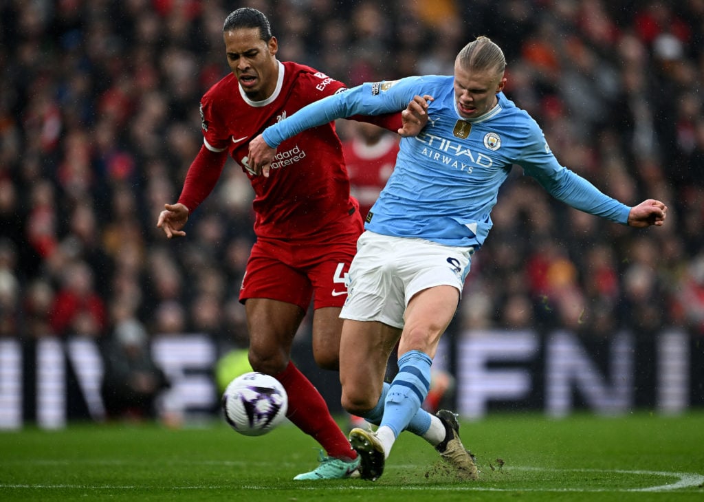 Manchester City's Norwegian striker #09 Erling Haaland shoots past Liverpool's Dutch defender #04 Virgil van Dijk but has his shot saved during the...