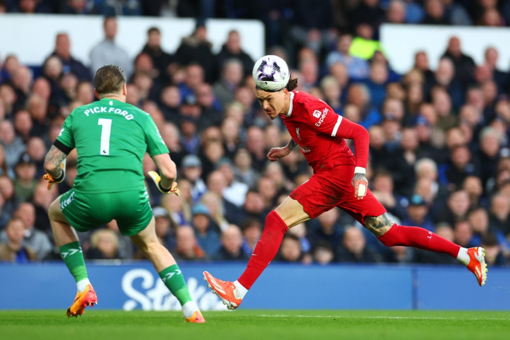 Jordan Pickford of Everton in action with Darwin Nunez of Liverpool during the Premier League match between Everton FC and Liverpool FC at Goodison...