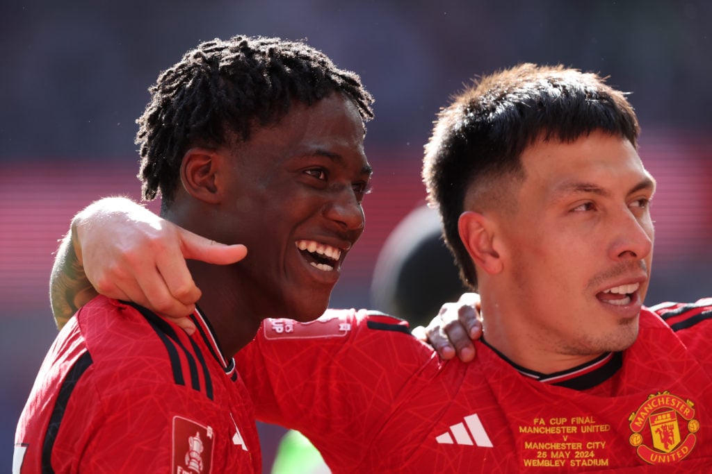 Kobbie Mainoo of Manchester United and Lisandro Martinez of Manchester United celebrate after the Emirates FA Cup Final match between Manchester Ci...