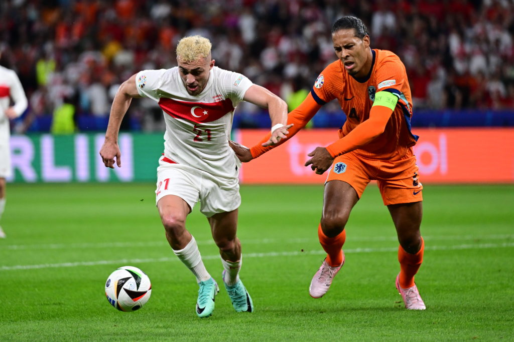 Baris Alper Yilmaz (L) of Turkiye in action against Van Dijk of Netherlands during the UEFA EURO 2024 Quarter-Final football match between Netherla...