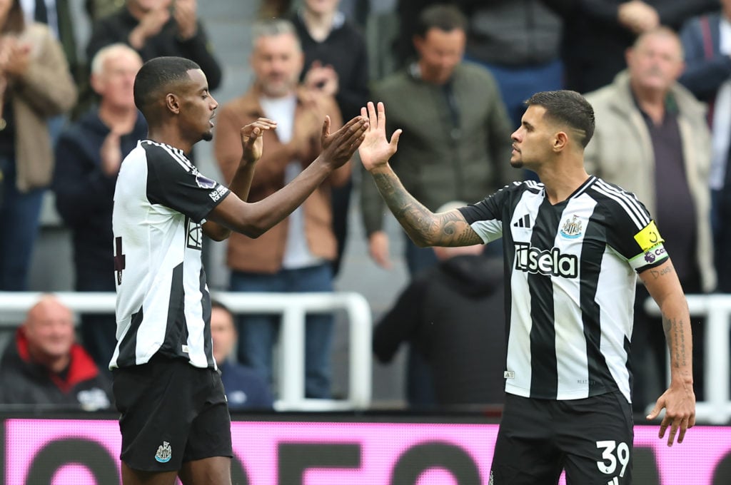 Alexander Isak of Newcastle United celebrates scoring his team's second goal with teammate Bruno Guimaraes during the Premier League match between ...